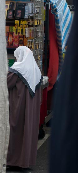 Moslem woman shopping in market